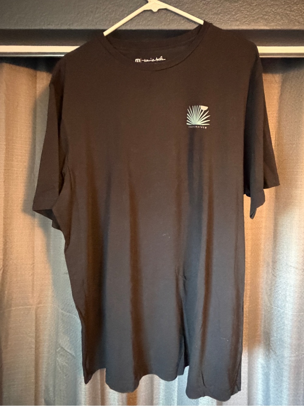 Travis Mathew Black Short-Sleeve Tee with Teal Palm Pocket Graphic